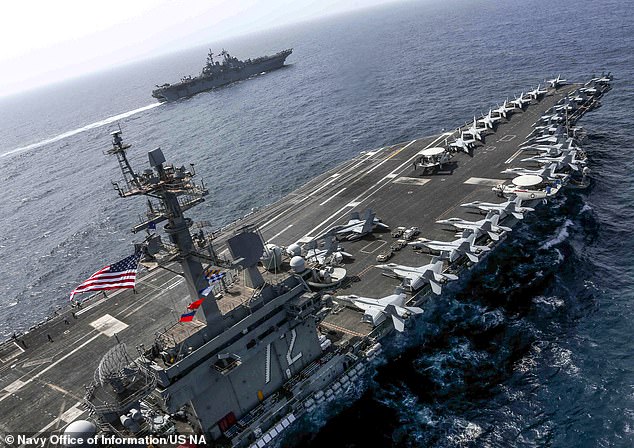 Austin ordered the USS Abraham Lincoln carrier strike group (pictured) to move quickly into the area