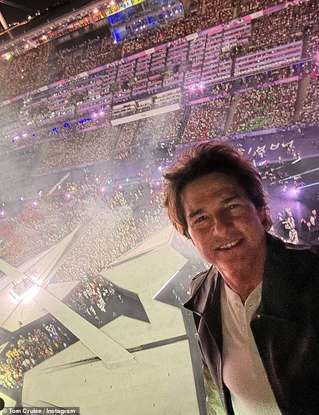 Tom shared a selfie from the top of the stadium before performing the death-defying stunt