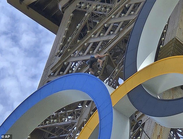 Davis was spotted just above the Olympic rings that adorn the second part of the monument