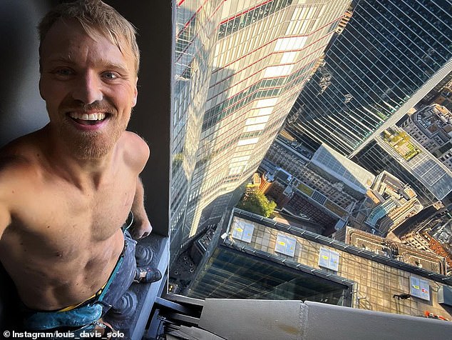 Davis stands atop London's famous Cheesegrater building after a daring climb in September 2023