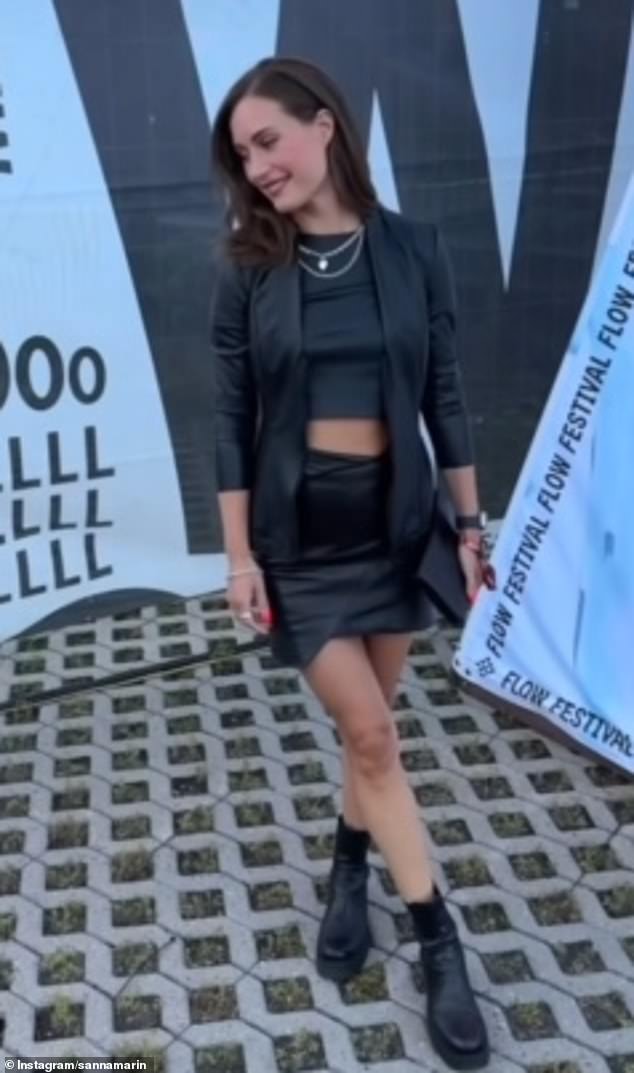 Sanna, who was the world's youngest prime minister, wore a black leather miniskirt and matching crop top for the occasion