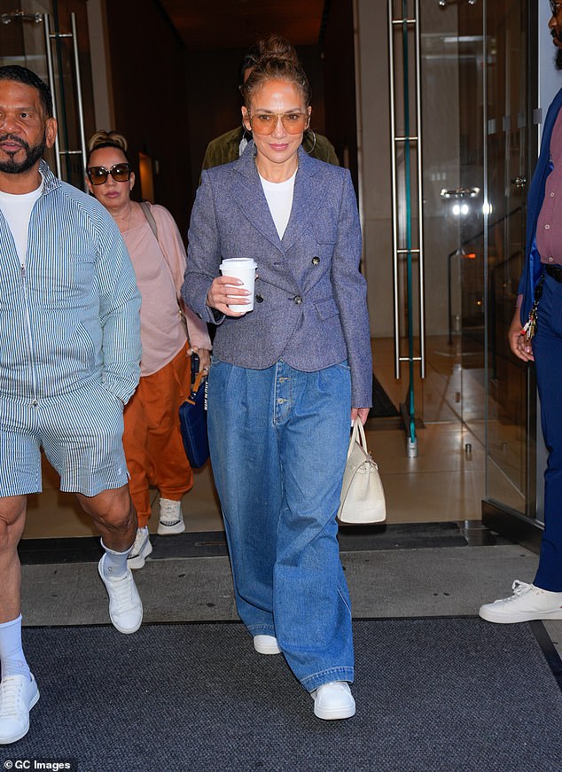 Lopez is seen with her entourage in New York City on July 26