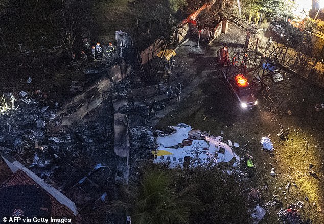 Aerial view of the wreckage of the Voepass plane next to the apartment building where it crashed Friday in Vinhedo, a city in the southeastern Brazilian state of São Paulo. All 58 passengers and four crew members were killed