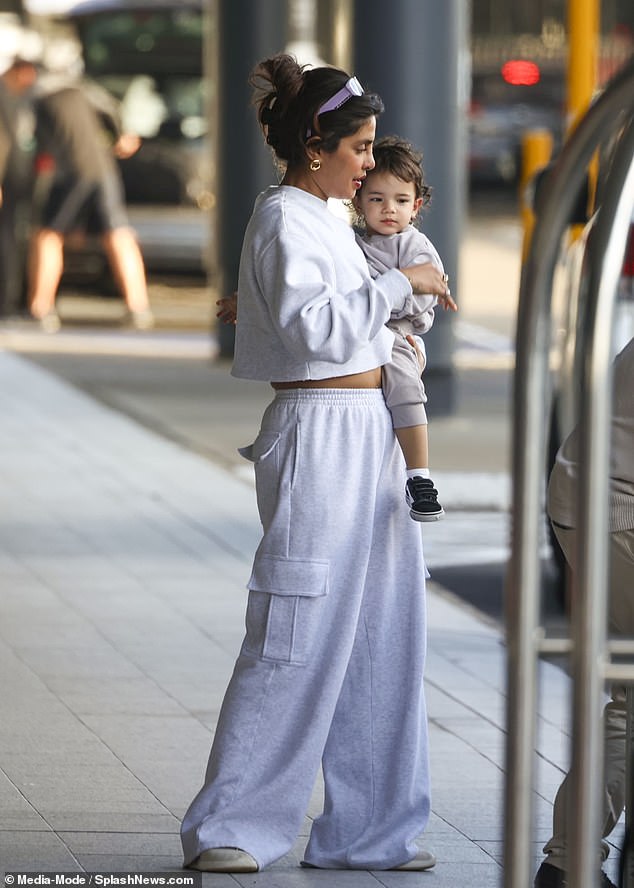 Priyanka held her little one as they left Australia