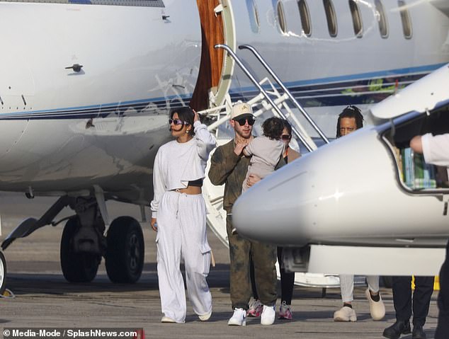 Chopra and her husband walked in front of the plane