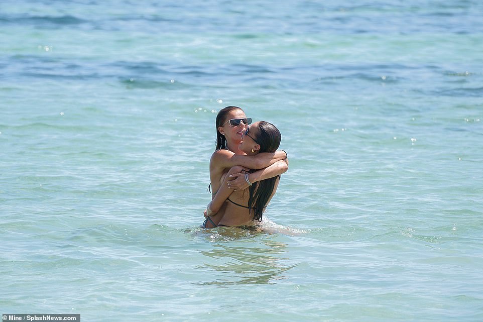 The ladies were also spotted embracing as they splashed around at the world-famous resort