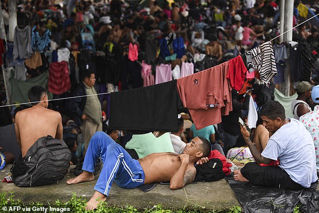 Migrants, mainly from Central America and Venezuela, rest on their way to the United States to escape poverty and violence on the outskirts of Huixtla, Chiapas state, Mexico.