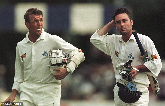 England's Graham Thorpe (right) and Alec Stewart come off the field with their helmets, gloves and bats after hitting a 150-all on the fourth day of the second Test match against Zimbabwe.