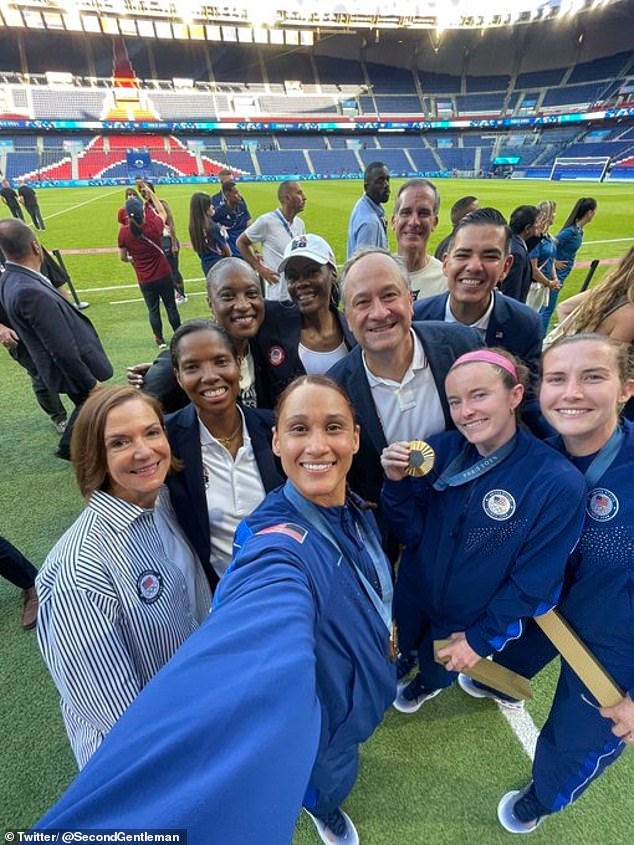 Doug Emhoff with the women's soccer team after their gold medal win