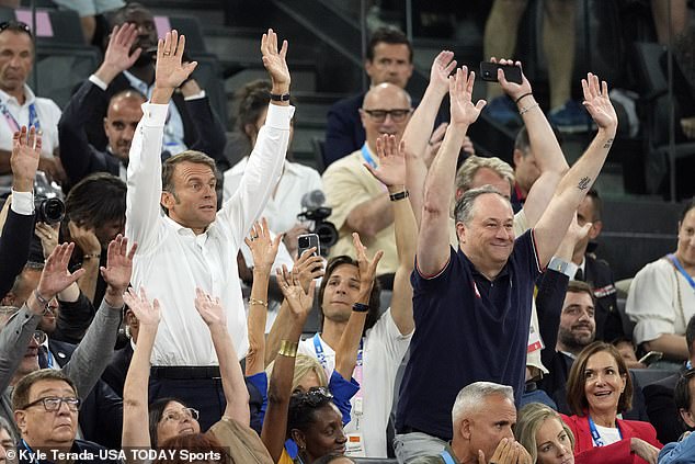 French President Emmanuel Macron and his deputy Douglas Emhoff cheer during the second half between the United States and France in the women's gold medal match