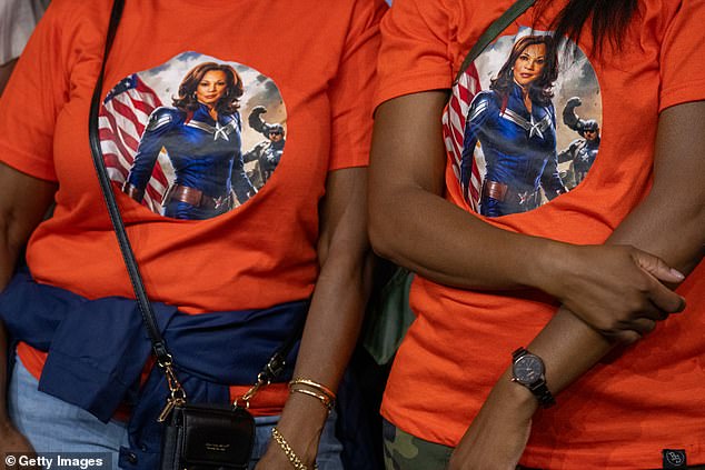 Women wear shirts featuring Democratic presidential candidate Kamala Harris as a superhero during a campaign rally on August 6, 2024 in Philadelphia, Pennsylvania