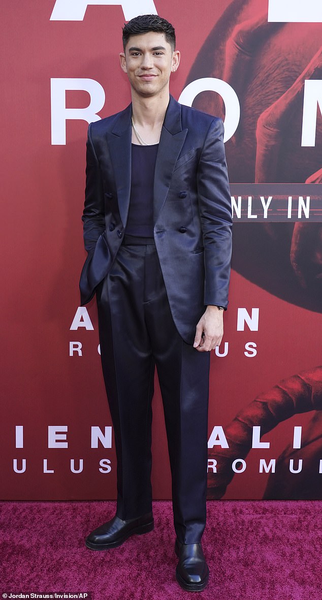 Archie looked handsome for the premiere as he wore an on-trend navy satin suit, complete with high-waisted trousers and a casual cardigan