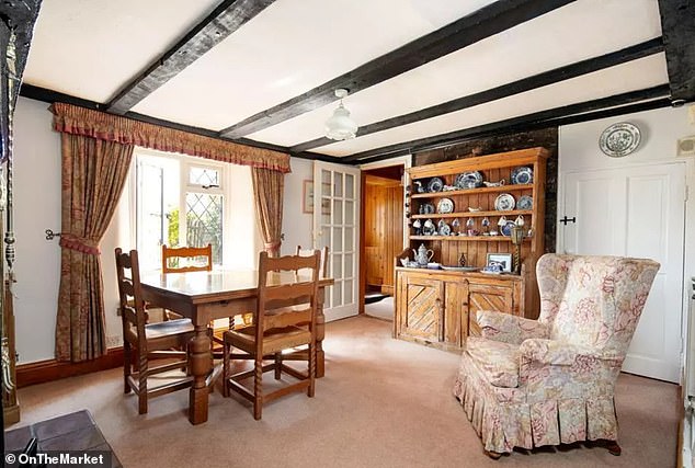 The cottage (pictured is the dining room) is one of the oldest in the area, with the local parish council having expressed 'reservations' about the scale of the planned extension