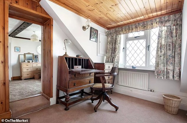 The current study space consists of a beautiful office chair and desk at the top of the stairs overlooking the sea