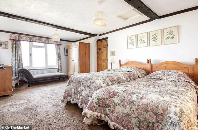 The master bedroom, which spans the entire depth of the property, has views in both directions