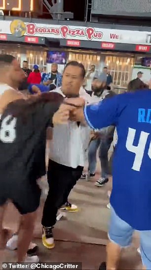 Men in both Cubs and White Sox uniforms attempted to intervene, but the situation quickly spiraled out of control from there