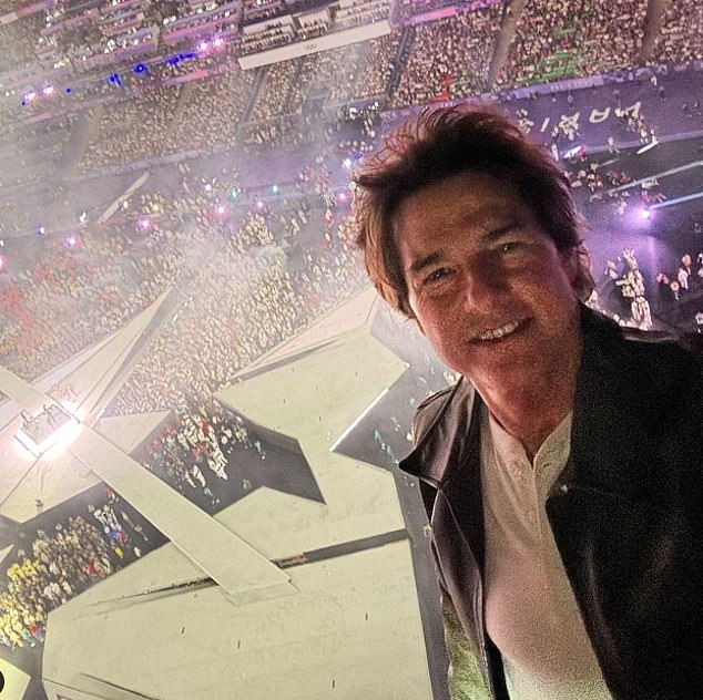 The star shared a selfie from the top of the stadium before performing the death-defying stunt