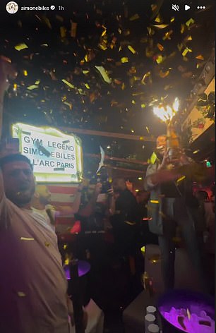 Biles' table at the nightclub was filled with champagne