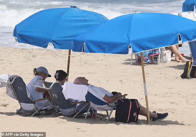 Biden leaned far back in his chair on Saturday as he sat with his wife Jill Biden and granddaughter Naomi