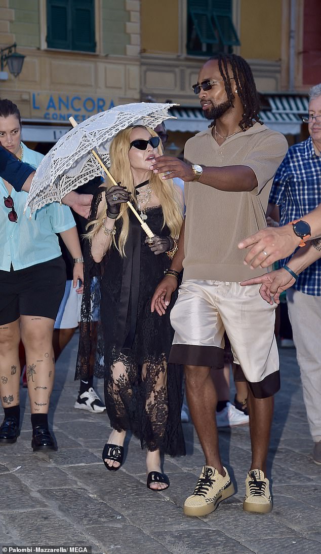 Madonna listened intently to her friend as they chatted on the way to lunch