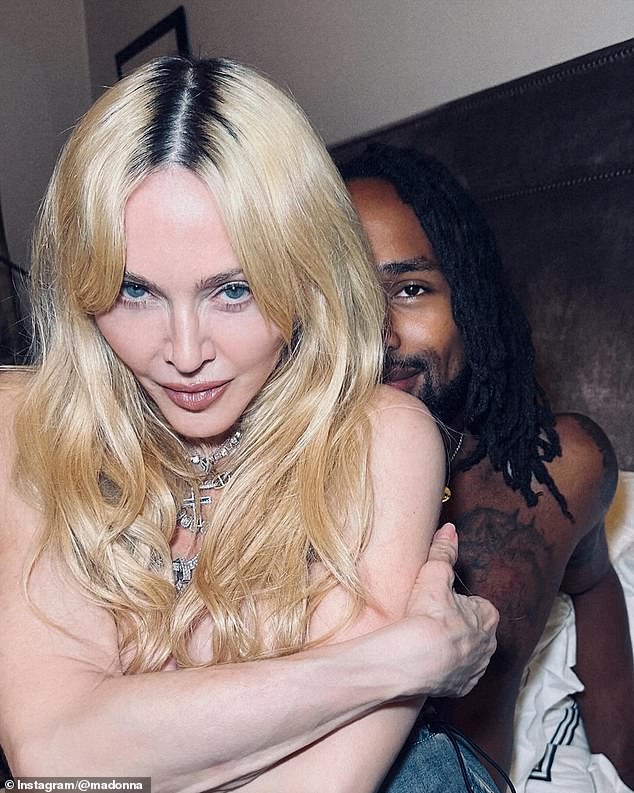 Madonna has shocked again as she went topless in a series of hot snaps posted on social media, including a steamy snap where she sits on the lap of her new toyboy lover