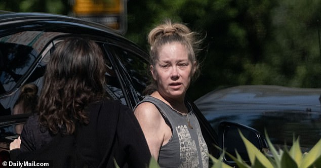 Exclusive photos obtained by DailyMail.com show Applegate stopping for a smoke break outside her car before an appointment near Hollywood