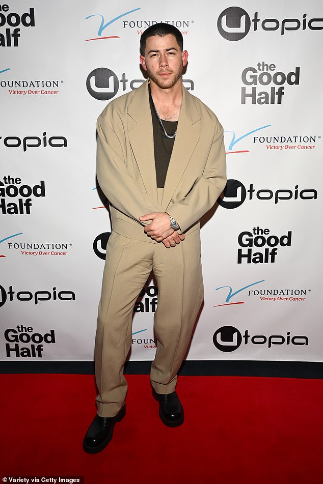 Jonas wore an oversized beige blazer with matching high-waisted trousers