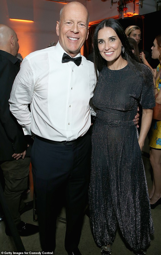 Bruce and Demi were married from 1987 to 2000 and remain amicable co-parents to their three children; they are pictured at his Comedy Central Roast in 2018