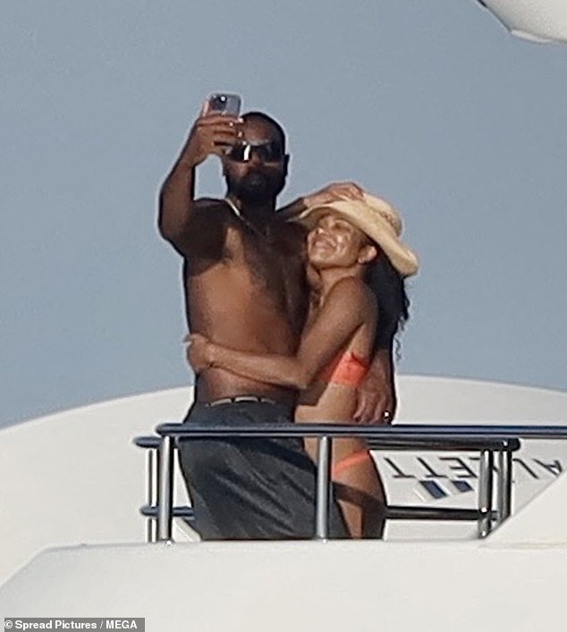 Gabrielle later shielded herself from the sun with a braided straw sun hat as she hugged Dwyane, shirtless, as they posed for a photo looking radiant