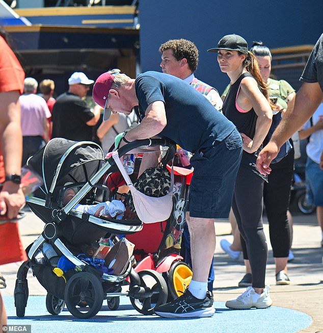 Gordon was photographed checking that Jesse was okay in the stroller