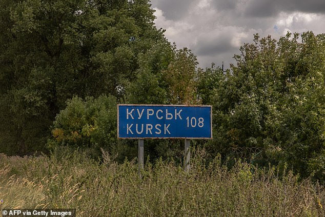 This photo shows a road sign indicating the distance to the Russian city of Kursk, next to the destroyed border crossing with Russia, in the Sumy region, on August 13, 2024.