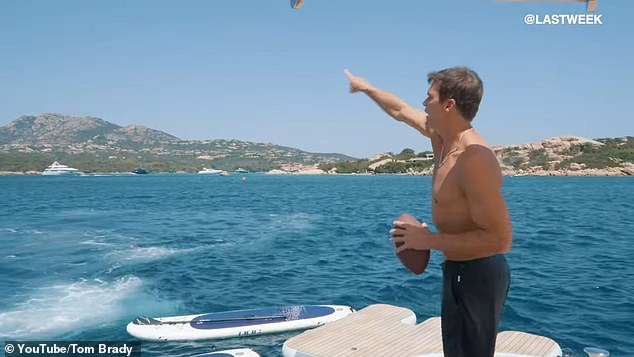 Brady shows off his arm while relaxing on a yacht somewhere in Europe