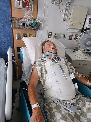 Mr. Munson is pictured above in hospital after an accident last year