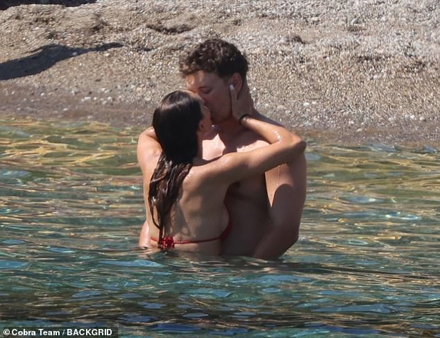 The couple, who tied the knot in December, didn't shy away from putting on a very loving show as they enjoyed a dip in the sea amid the warm weather