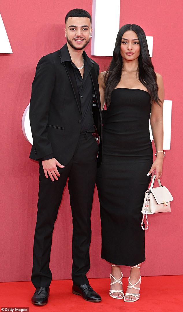 The couple, who went Instagram official in June, wore stylish black ensembles