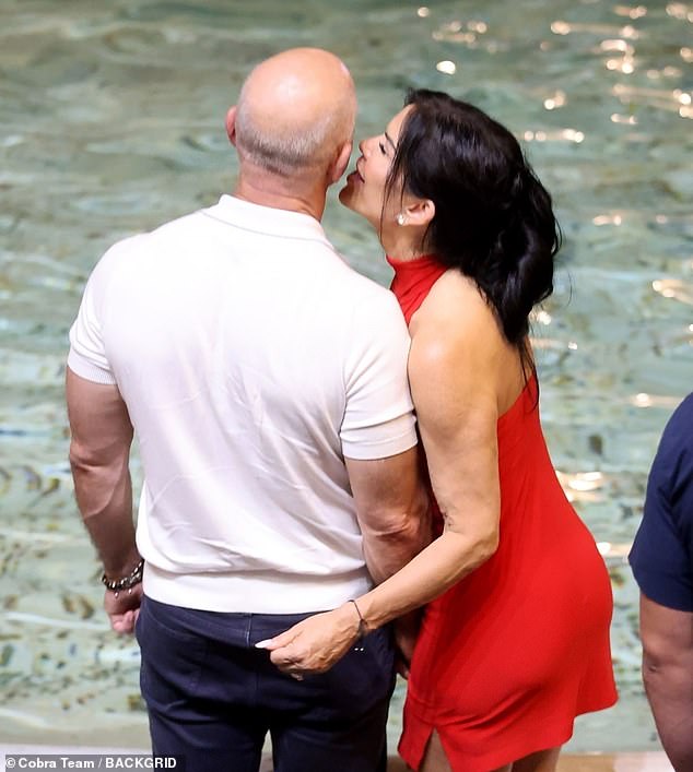 The couple looked very much in love as they put on a loving display in the crowd at the Trevi Fountain