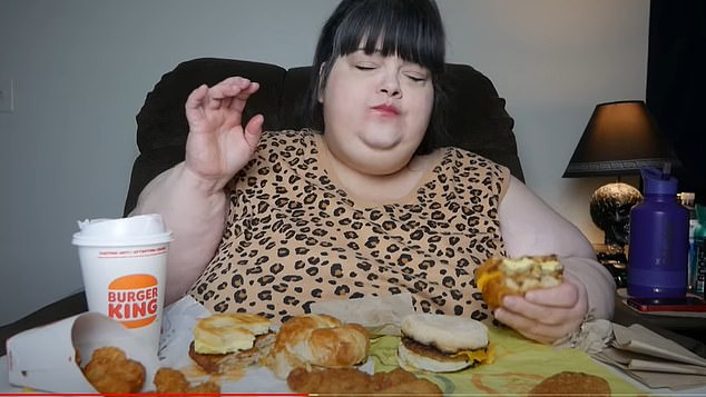 Chinese mukbanger Pan Xiaoting (pictured eating a Burger King) has died in a shocking manner while gorging himself on 10 kilos of food, live on camera