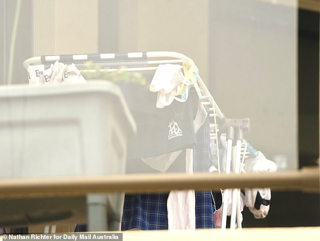 In a heartbreaking reminder of the domestic tragedy, pieces of little Sophie's school uniform were seen hanging on a line to dry on the balcony at the back of the house (pictured)