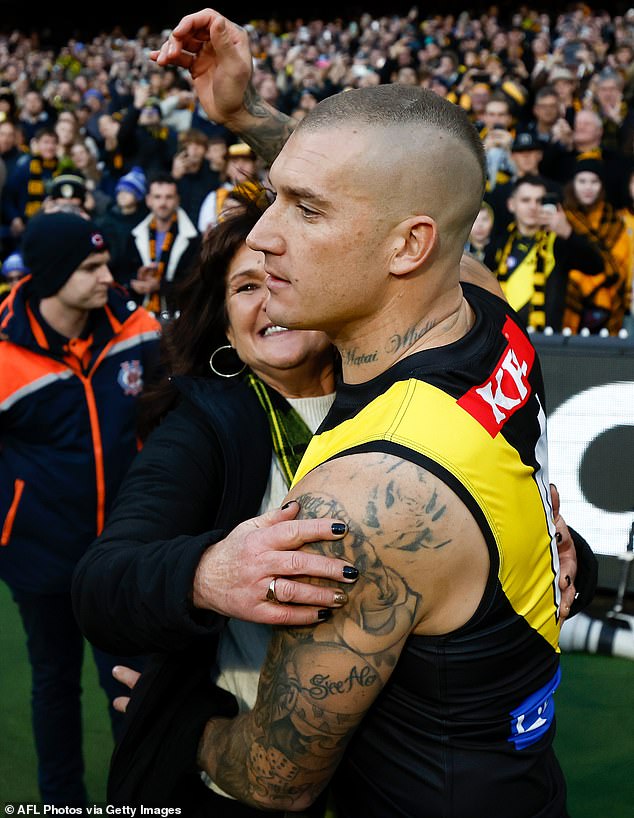 Martin (pictured with his mother Kathy before playing his 300th AFL game) is the subject of intense speculation about what he will do after retirement