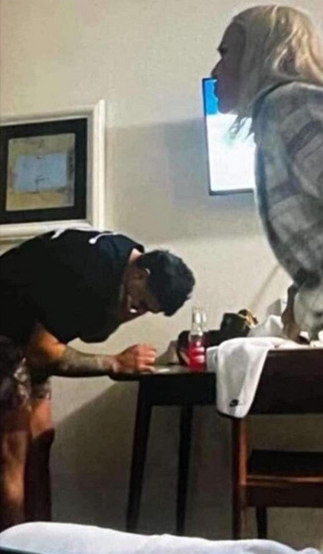 Brown (right) denies she is responsible for leaking the photo, which appears to show Mitchell hunched over an unknown white powder on a table (pictured)