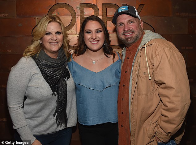 Another source said that Garth - who has three daughters with ex-wife Sandy Mahl - is doing everything he can to make sure his kids don't grow up lavishly. He was seen with Trisha and Allie in 2017