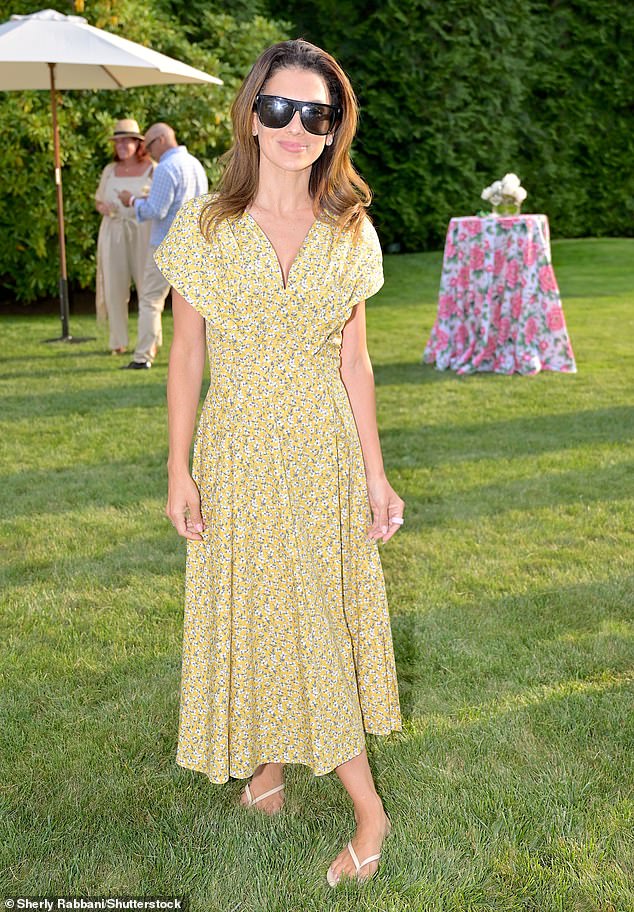 Hilaria looked radiant for the premiere in a yellow floral print summer dress and white mules