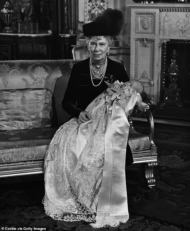 Queen Mary, The Queen Mother, holds her great-grandson Prince Charles after his christening at Buckingham Palace