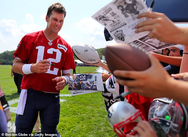 Tom Brady signs autographs after New England Patriots training camp at Gillette Stadium