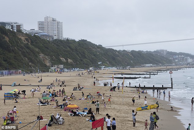 Holidaymakers enjoyed a day at the beach in Bournemouth yesterday in cloudy weather