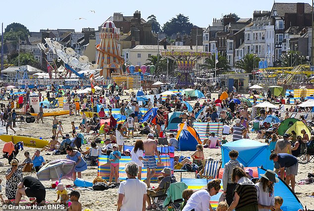 Weymouth beach in Dorset is busy with holidaymakers and sun worshippers on Tuesday