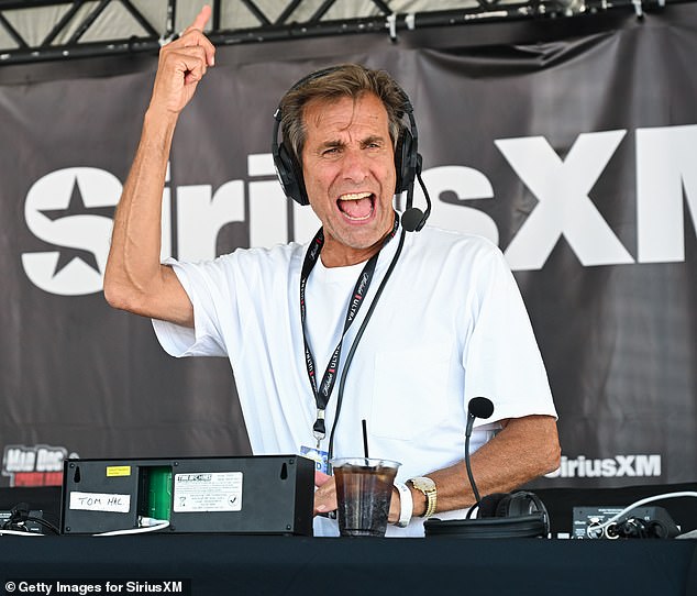 Chris Russo is seen during a remote broadcast on the Jersey shore in July