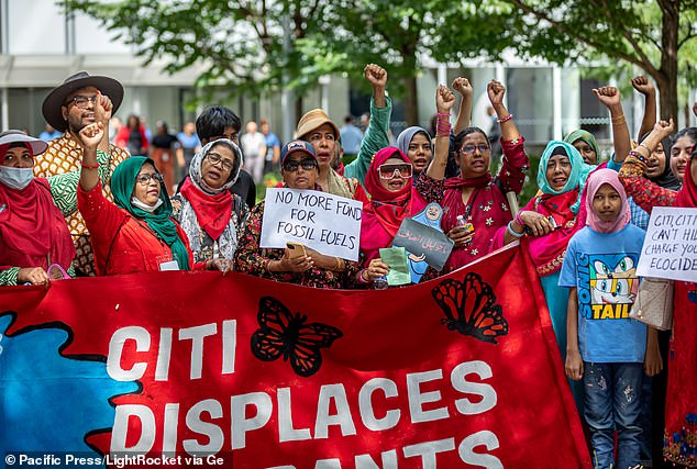 Pictured: A coalition of immigrant communities and climate activists protest outside Citigroup’s headquarters. Activists, some of whom are members of Extinction Rebellion and the Sunrise Movement, took part in the protest, which targeted immigrant communities affected by the bank’s financial support for fossil fuel industries.