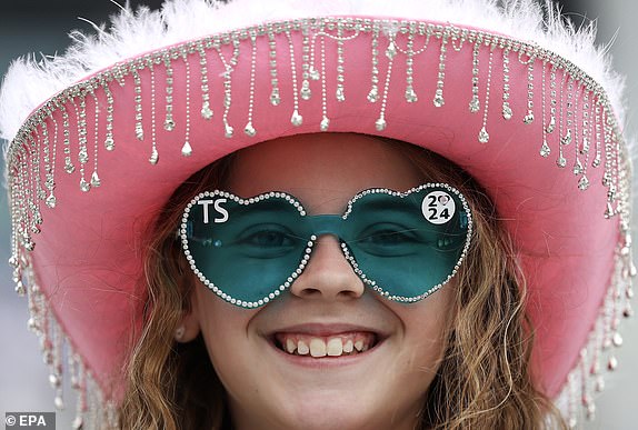 epa11550201 A young Taylor Swift fan poses outside Wembley Stadium before the first concert of the Eras Tour at Wembley Stadium in London, Britain, August 15, 2024. The final concerts of the American pop star's Eras Tour in Europe will take place at Wembley Stadium in London from August 15 to 20, 2024. The concerts will go ahead amid extra security measures following the cancellation of Swift's three shows in Vienna earlier in August 2024. The London Metropolitan Police spokesman said that 