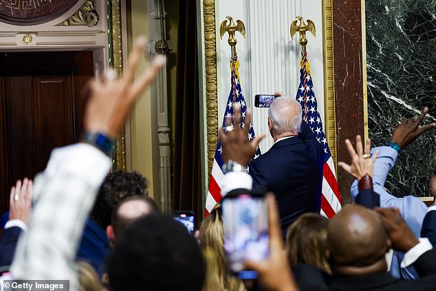 President Joe Biden takes a selfie with the 100 or so TikTokers invited to the White House for the first-ever 'Creator Economy Conference'